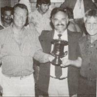 Bill Thomas, with Coach JohnO'Connell (far right) accepts the1985 Night Series Trophy